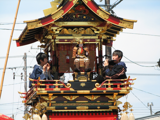 Children playing music on a float