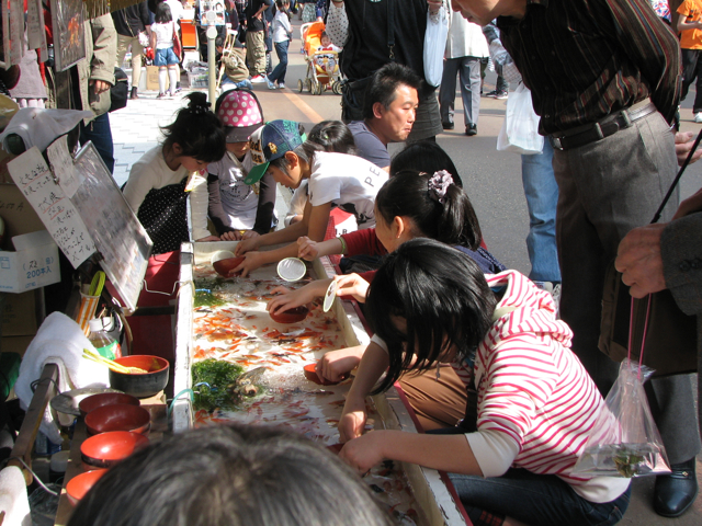 Children fishing for their favorite goldfish