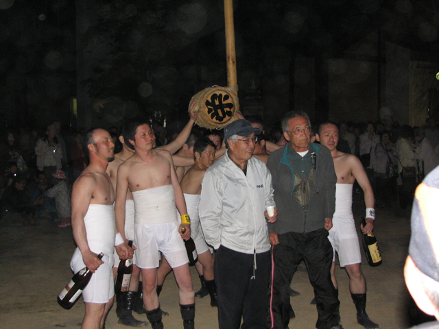 Posing with their drum and their sake